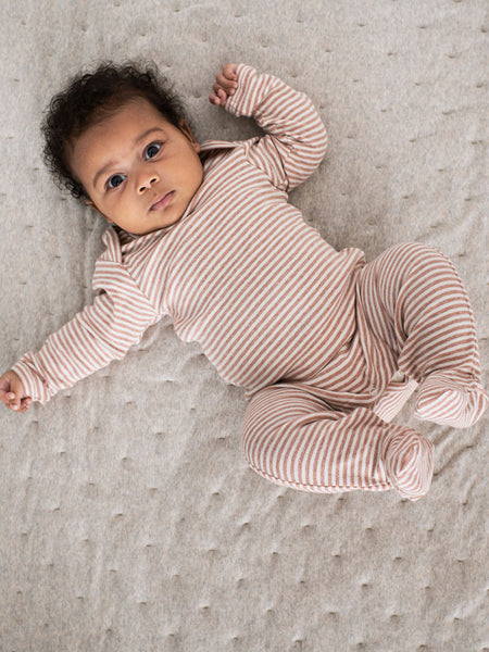 baby in clay stripe babysuit